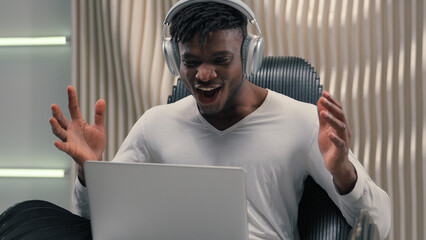 African American ethnic cyber man in white futurism studio indoors business male user gamer hacker...