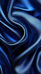 Obraz premium Elegant deep blue satin fabric showcasing smooth folds and rich texture in soft light