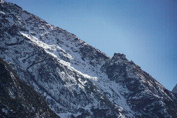 Majestic snow-capped mountain peak himalayan region landscape photography clear sky elevated viewpoint natural beauty