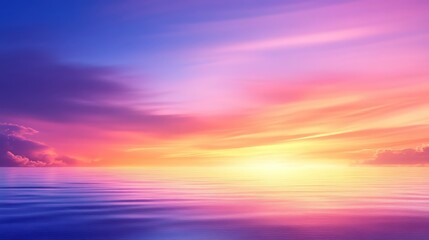Obraz premium A breathtaking sunset over calm waters, showcasing vibrant hues of purple, pink, and orange in the sky, reflecting beautifully on the tranquil surface, creating a serene atmosphere
