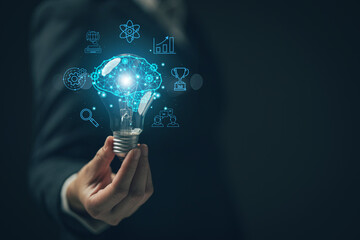 Woman holding light bulb. Online education concept. Finding ideas for work Planning student learning with a self-learning system via online channels..Searching for new business ideas.