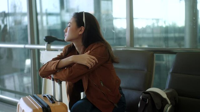 Unhappy young woman traveler disappointed with flight delay or cancelation while waiting at airport terminal, female tourist upset after receiving bad news when sitting at airline lounge.
