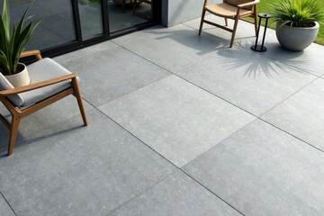 Serene Outdoor Patio with Light Gray Porcelain Tiles, Modern Wooden Chairs, and Lush Greenery