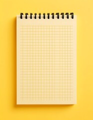 Grid Paper Notepad on Bright Yellow Background, Minimalist Workspace