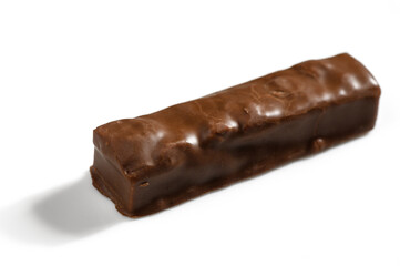 Chocolate confection with a smooth, glossy surface resting on a clean white backdrop