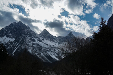 Majestic snow-capped mountains national park landscape photography dramatic clouds wide angle nature's grandeur