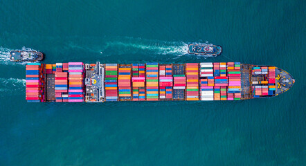 A large number of container ships are sailing at sea.
