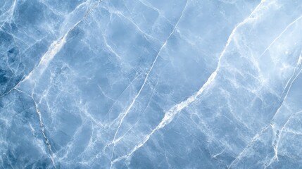 Obraz premium A stunning blue marble texture featuring intricate veins and patterns, perfect for backgrounds, wallpapers, or design projects. Ideal for showcasing elegance and sophistication.
