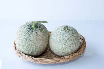 Japan melon in basket on white background.