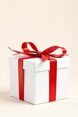 Obraz premium Isolated white box with bright red ribbon and shiny golden bow, gift wrap, ribbon, decorative gift