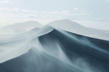 Expansive wind-sculpted sand dunes under soft light illustrate the tranquil beauty of a desert landscape during twilight hours
