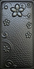 Embossed shiny black leather with a floral motif, material, design, embossed