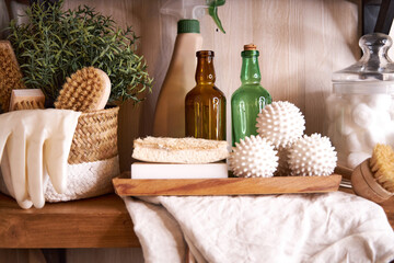 wooden shelf with accessories and cleaning products for washing, eco-friendly cleaning