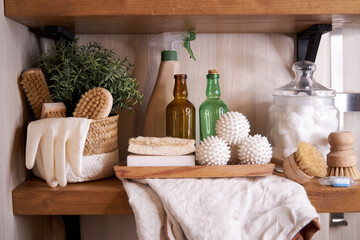 wooden shelf with accessories and cleaning products for washing, eco-friendly cleaning