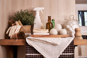 wooden shelf with accessories and cleaning products for washing, eco-friendly cleaning