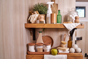 wooden shelf with accessories and cleaning products for washing, eco-friendly cleaning