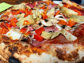 A Pizza on a plate in a Restaurant