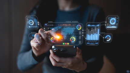 A person interacts with a futuristic smartphone, displaying digital data and graphs, emphasizing technology and user engagement.