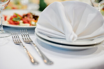 Elegant Table Setting With Napkin and Forks in a Restaurant..