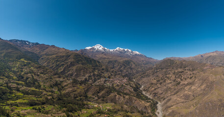 panoramic view from the willakollu viewpoint of sorata town, mountain Ancohuma and mountain illampu, the third and fourth highest mountains in Bolivia in the andes mountain range 