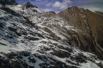 Obraz premium Stunning aerial view of snow-capped mountains alpine region landscape photography natural beauty majestic peaks