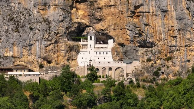 Drone view of Ostrog Monastery in the cliff high on the mountain in Montenegro