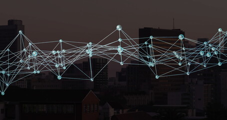 Network of connections and data processing image over cityscape at dusk