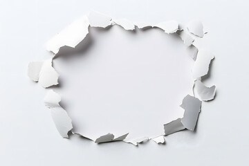 Abstract hole in white paper with torn edges background design