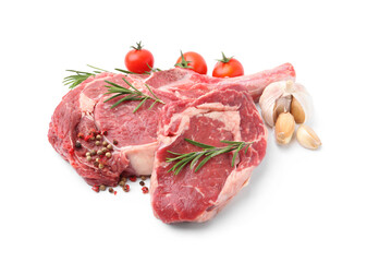 Pieces of raw beef meat, spices and tomatoes isolated on white