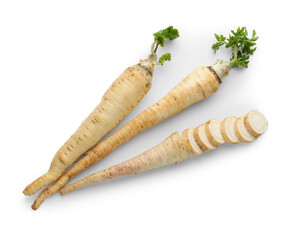 Whole and cut fresh parsley roots isolated on white, top view