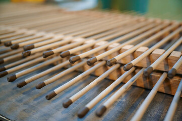 Crafting Bengal candles with precision and care in a vibrant factory filled with fragrant wax and...