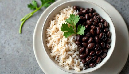 Bowl of White Rice and Black Beans with Parsley Garnish