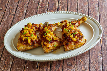 chicken leg quarters toped with peach chutney