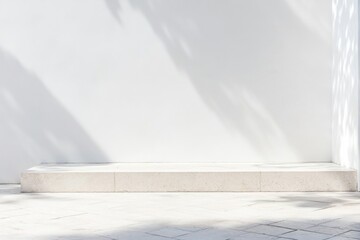 Minimalist display platform against a crisp white wall, bathed in soft shadows and bright sunlight