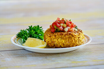 crispy fried crab cakes topped with pico de gallo