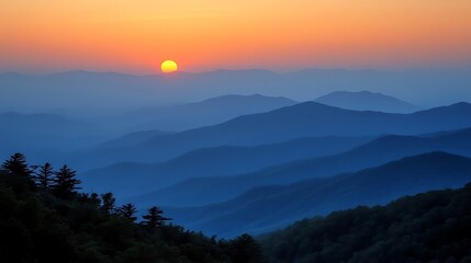 Obraz premium Layered Mountain Ridges at Dusk with Vivid Sunrise and Rolling Hills