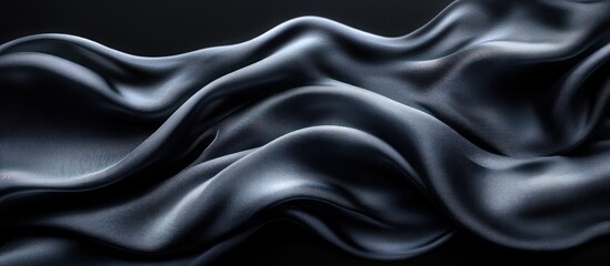 Obraz premium Dark gray fabric flowing elegantly.