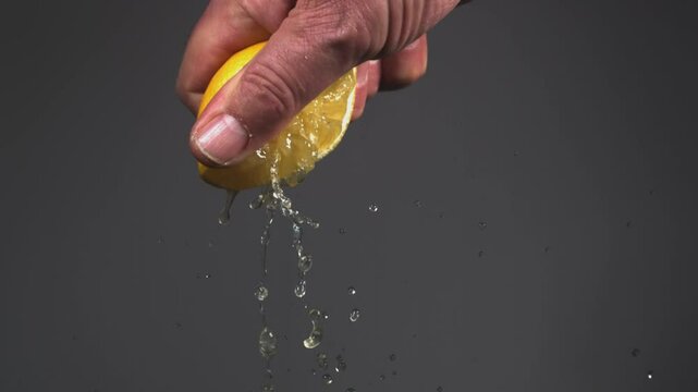 Squeezing the juice from a fresh lemon, super slow motion 2000fps