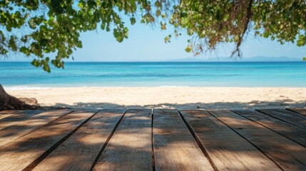 Fototapeta premium Serene tropical beach view from wooden deck under lush foliage capturing the essence of summer paradise with turquoise sea and clear blue sky