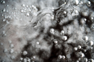 Ice surface, texture with cracks, bubbles and frozen leaves for computer graphics, texturing, compositing or as a background