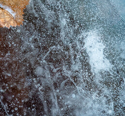 Ice texture with cracks, bubbles and frozen leaves for computer graphics, texturing, compositing or as a background