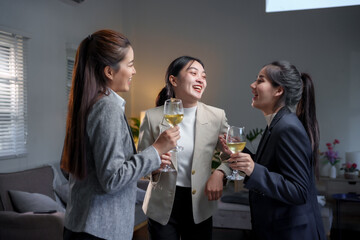 Three professional women enjoying a social gathering