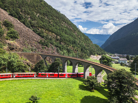 Aerial view of spiral viaduct of Rhaetian Railway, Grisons canton, Switzerland - Powered by Adobe