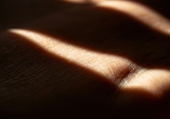 Fototapeta premium Close-up of a hand with soft shadows creating a textured pattern