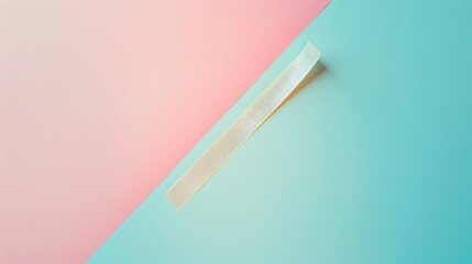 A single celluloid strip is laid flat on a softly colored pastel backdrop that blends pink and blue. This arrangement emphasizes a clean and simplistic aesthetic perfect for design inspiration