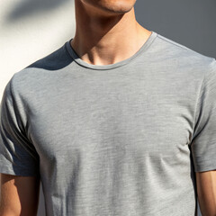 Close-up of a male wearing a plain gray shirt during daytime urban setting portrait photography