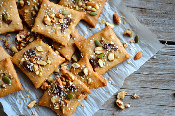 Rustic cookies with irregular shapes delight the eye and palate. Studded with chocolate, nuts, and seeds, they radiate a cozy, homemade allure perfect for dessert enthusiasts.