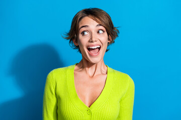 Photo of funky astonished person open mouth look empty space advert isolated on blue color...