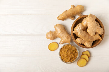 Fresh ginger on wooden background. Dry ginger. Sliced ​​ginger with honey and lemon. Ginger root. Traditional alternative medicine, healing tea for immunity. Seasoning and spices concept. Copy space.