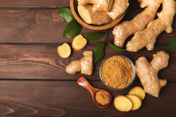 Fresh ginger on wooden background. Dry ginger. Sliced ​​ginger with honey and lemon. Ginger...